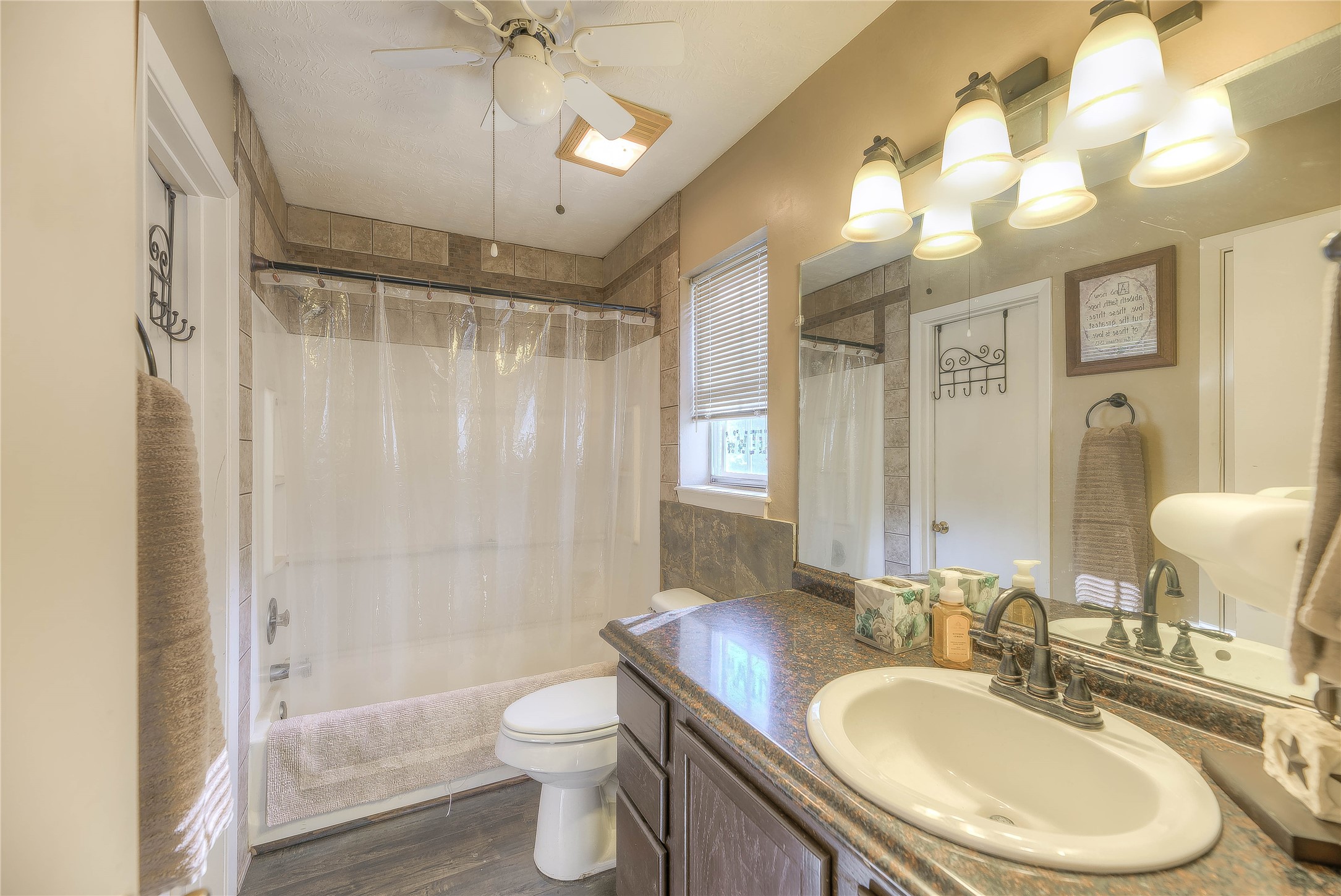 300 L Green Road Cleveland, TX 77328 - Photo 22 of 44 a bathroom with a granite countertop sink toilet a mirror a vanity and shower