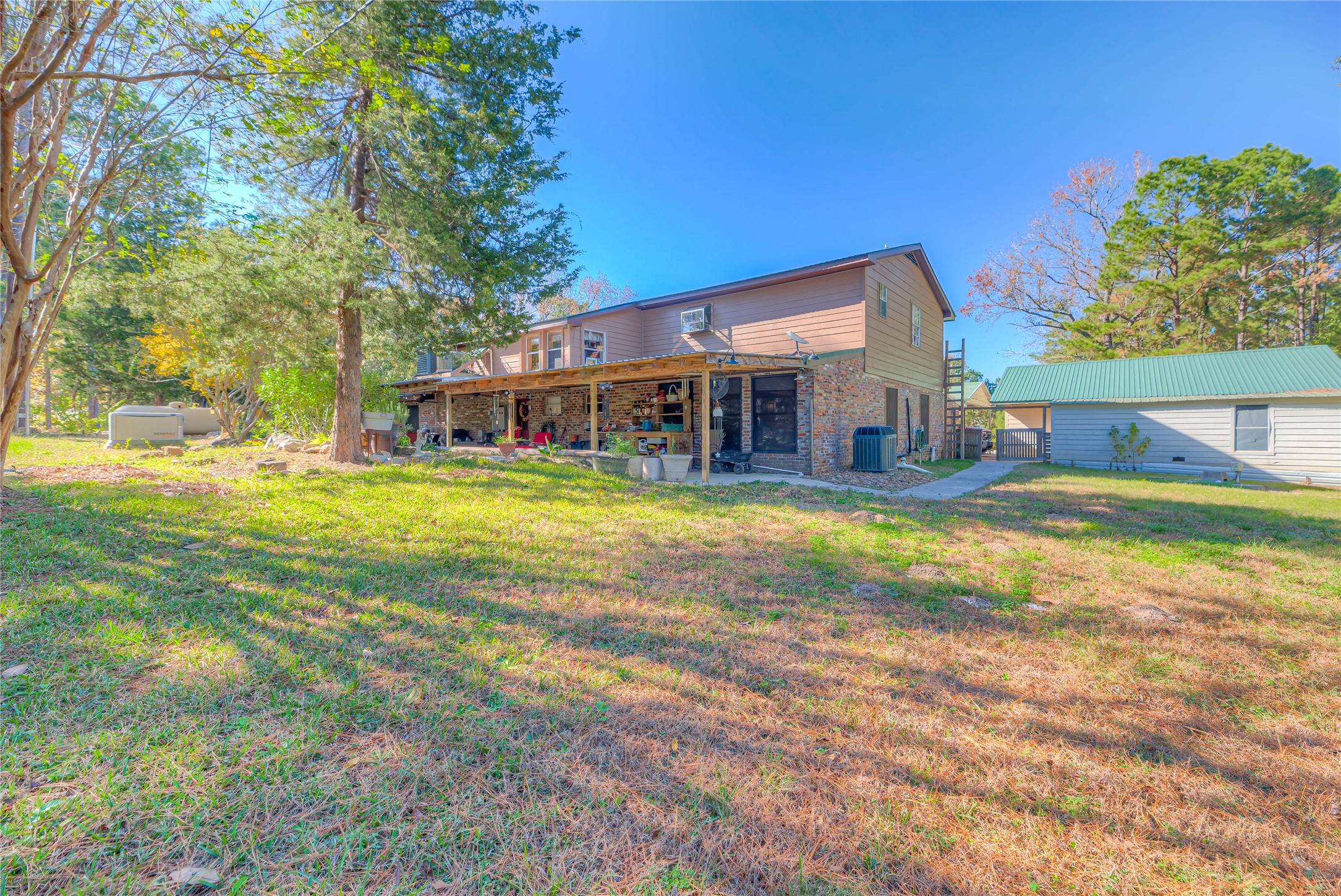 300 L Green Road Cleveland, TX 77328 - Photo 25 of 44 a view of a house with swimming pool and sitting area