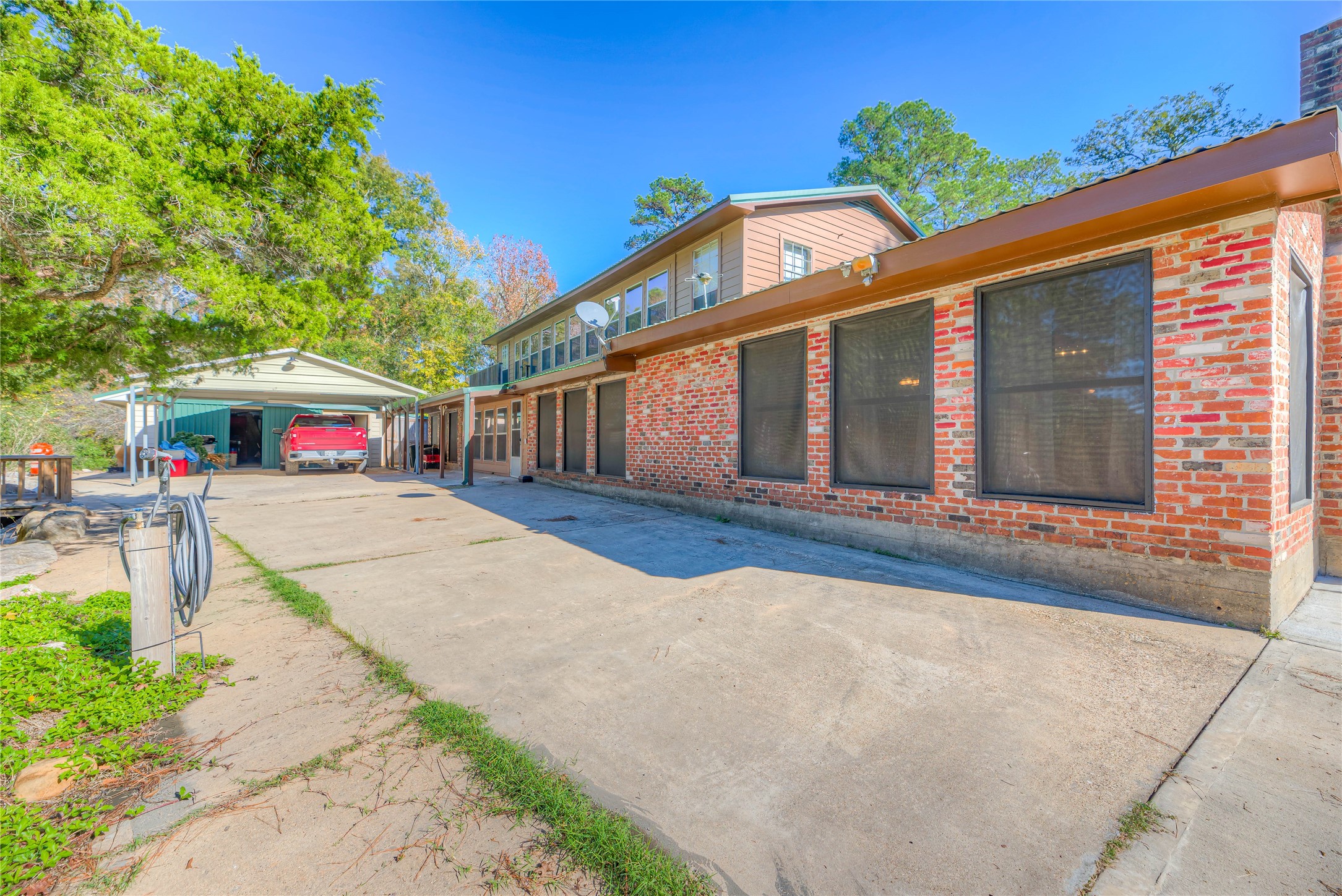300 L Green Road Cleveland, TX 77328 - Photo 27 of 44 a view of a house with a patio
