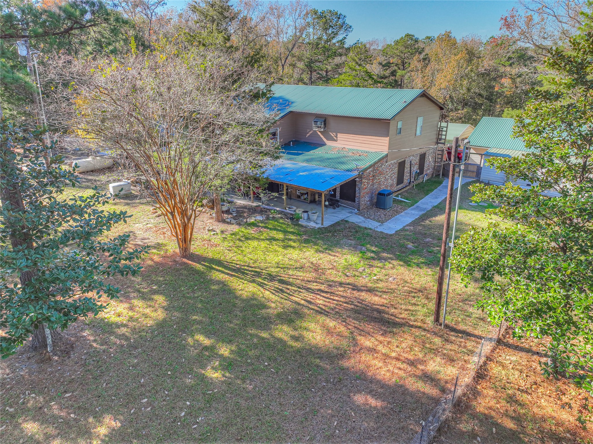 300 L Green Road Cleveland, TX 77328 - Photo 44 of 44 a view of a house with pool yard and sitting area