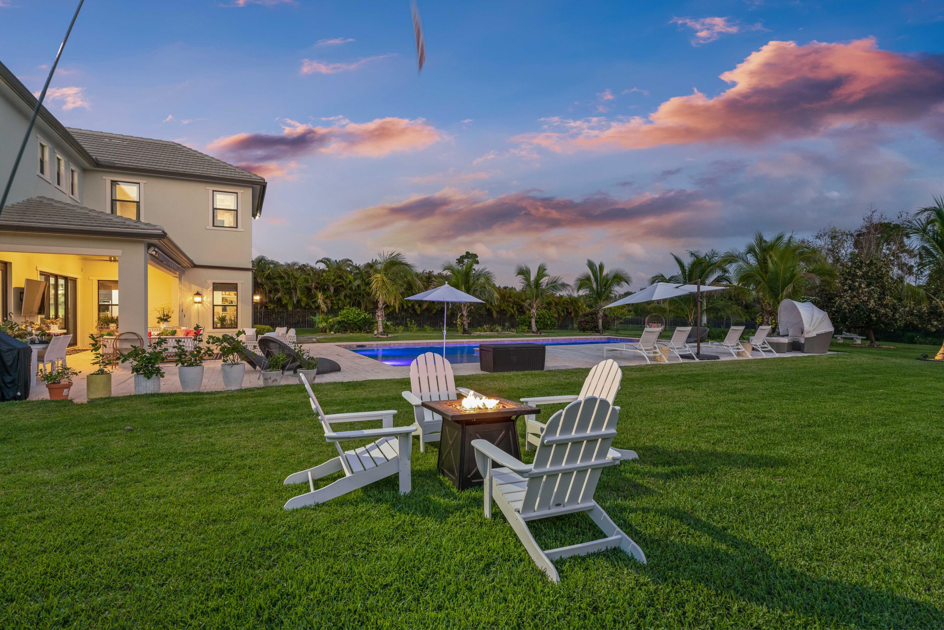 8208 Southeast Red Root Way Jupiter, FL 33458 - Photo 3 of 113 Twilight Backyard