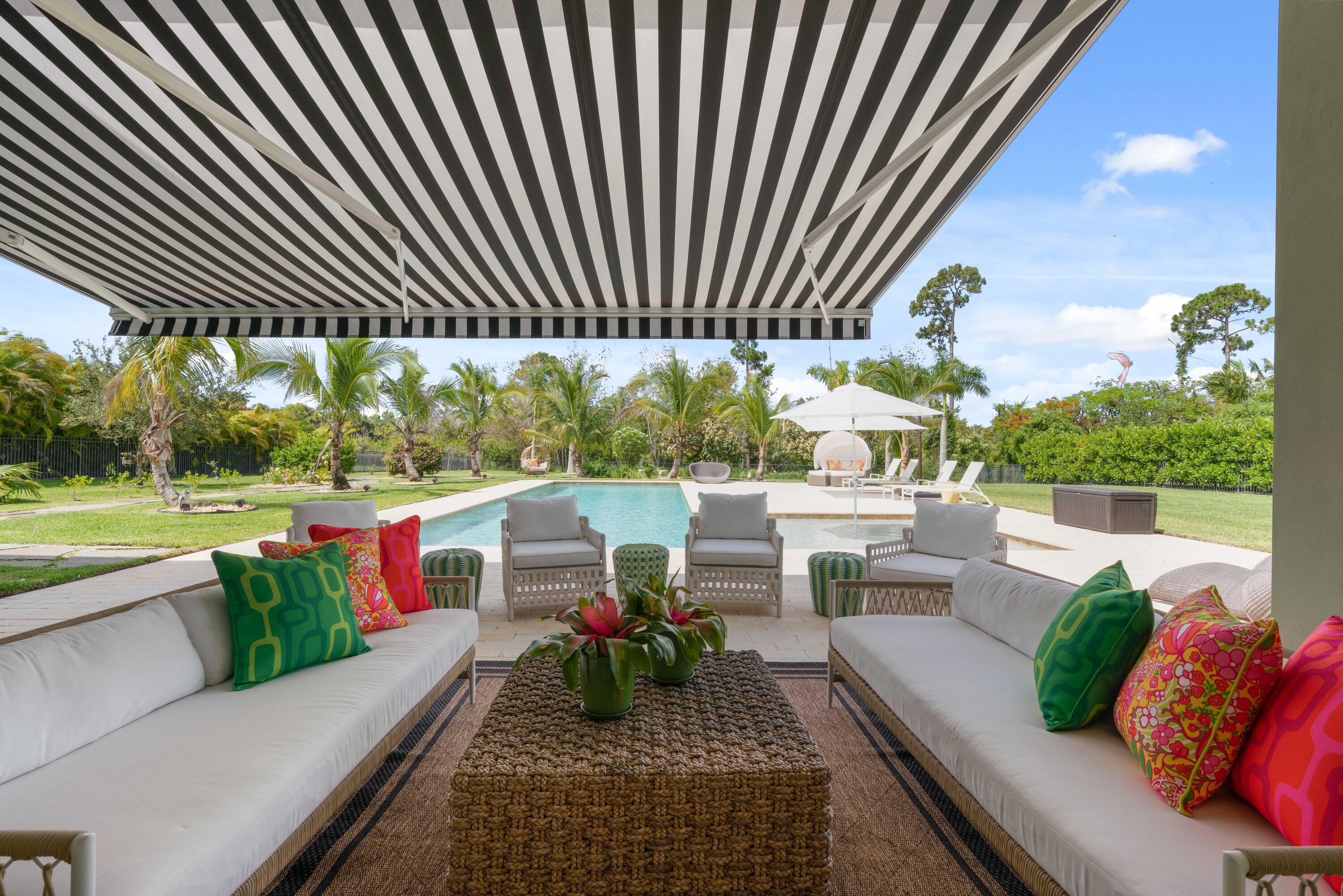 8208 Southeast Red Root Way Jupiter, FL 33458 - Photo 71 of 113 Loggia with Awning