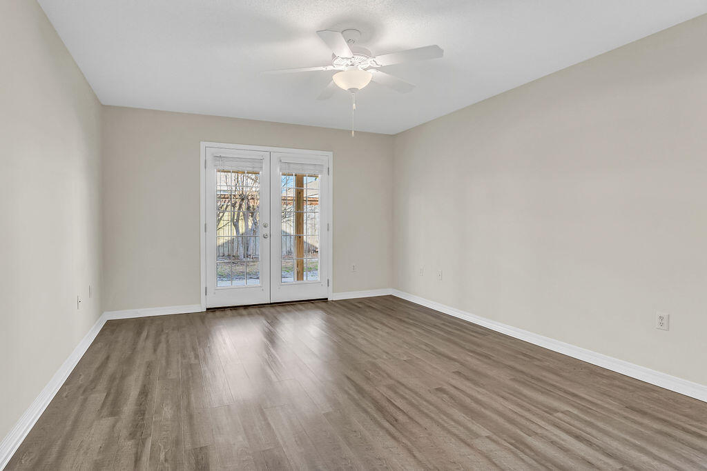 4641 Sunsail Circle Destin, FL 32541 - Photo 14 of 28 wooden floor in an empty room with a window