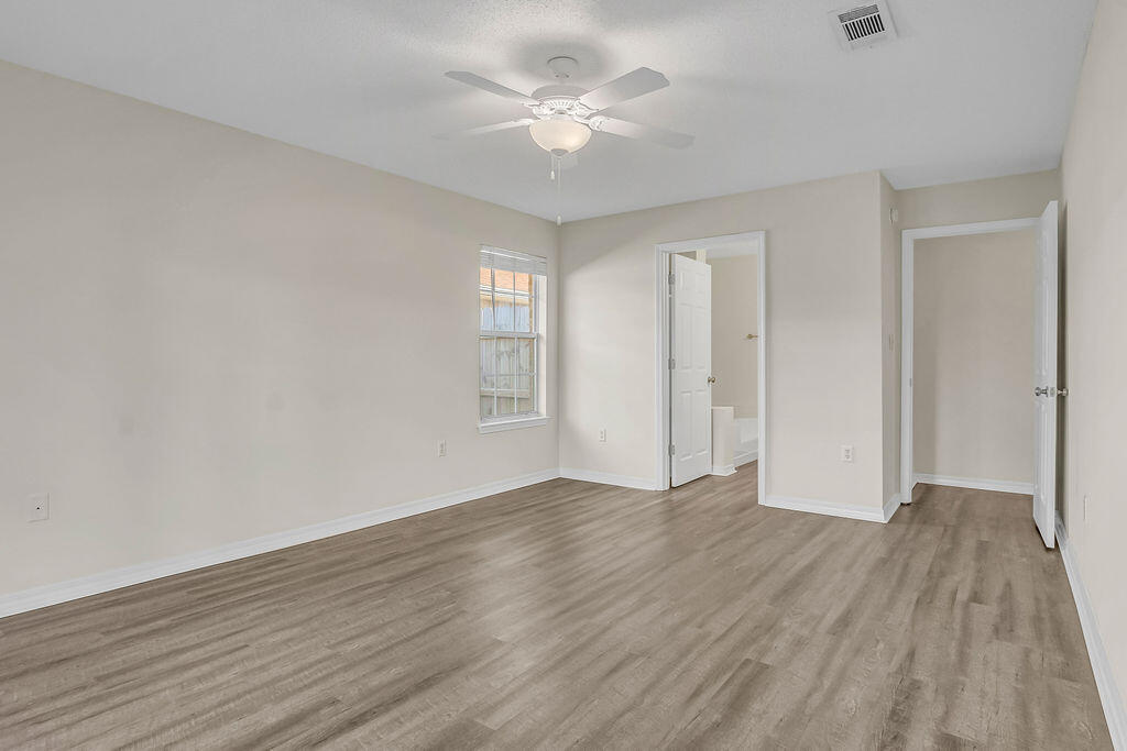 4641 Sunsail Circle Destin, FL 32541 - Photo 15 of 28 wooden floor in an empty room with a window