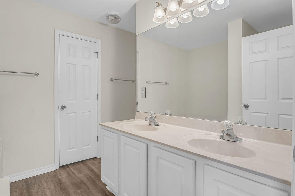 4641 Sunsail Circle Destin, FL 32541 - Photo 16 of 28 a bathroom with a sink a light fixture and a mirror