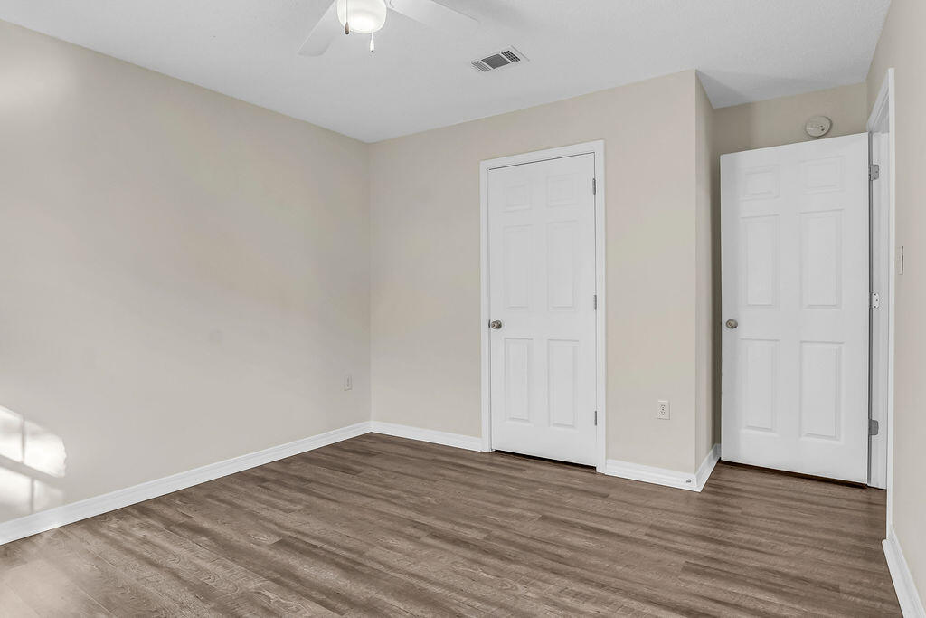 4641 Sunsail Circle Destin, FL 32541 - Photo 22 of 28 a view of an empty room with wooden floor