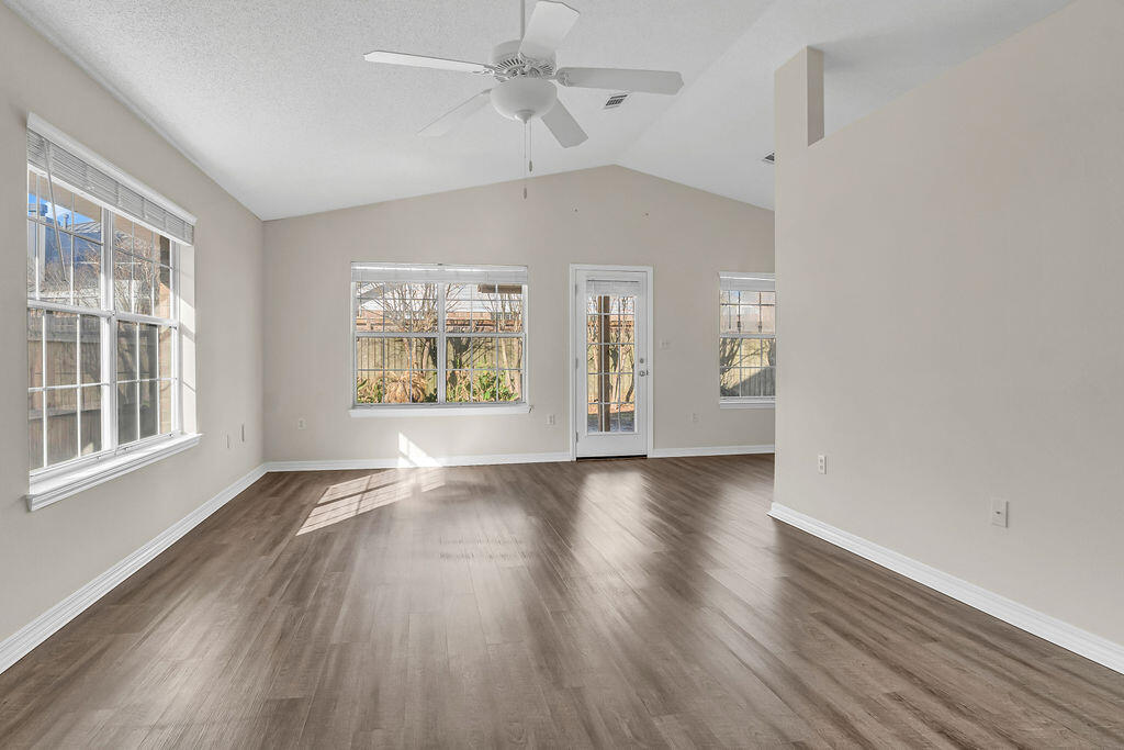 4641 Sunsail Circle Destin, FL 32541 - Photo 6 of 28 wooden floor in an empty room with a window