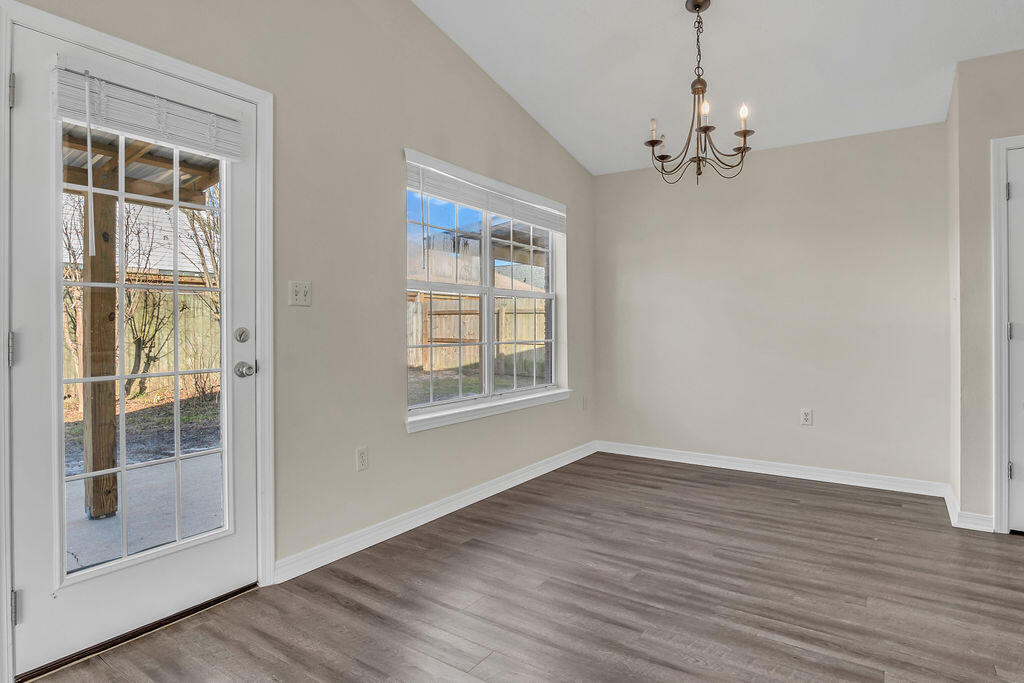 4641 Sunsail Circle Destin, FL 32541 - Photo 8 of 28 a view of empty room with wooden floor and fan