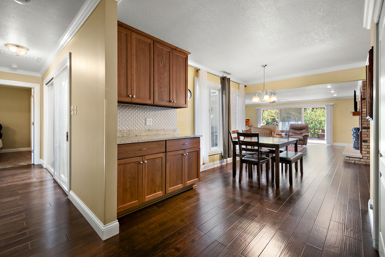 1305 Oaktree Lane Kankakee, IL 60901 - Photo 17 of 47 a kitchen with wooden floors and wooden cabinets
