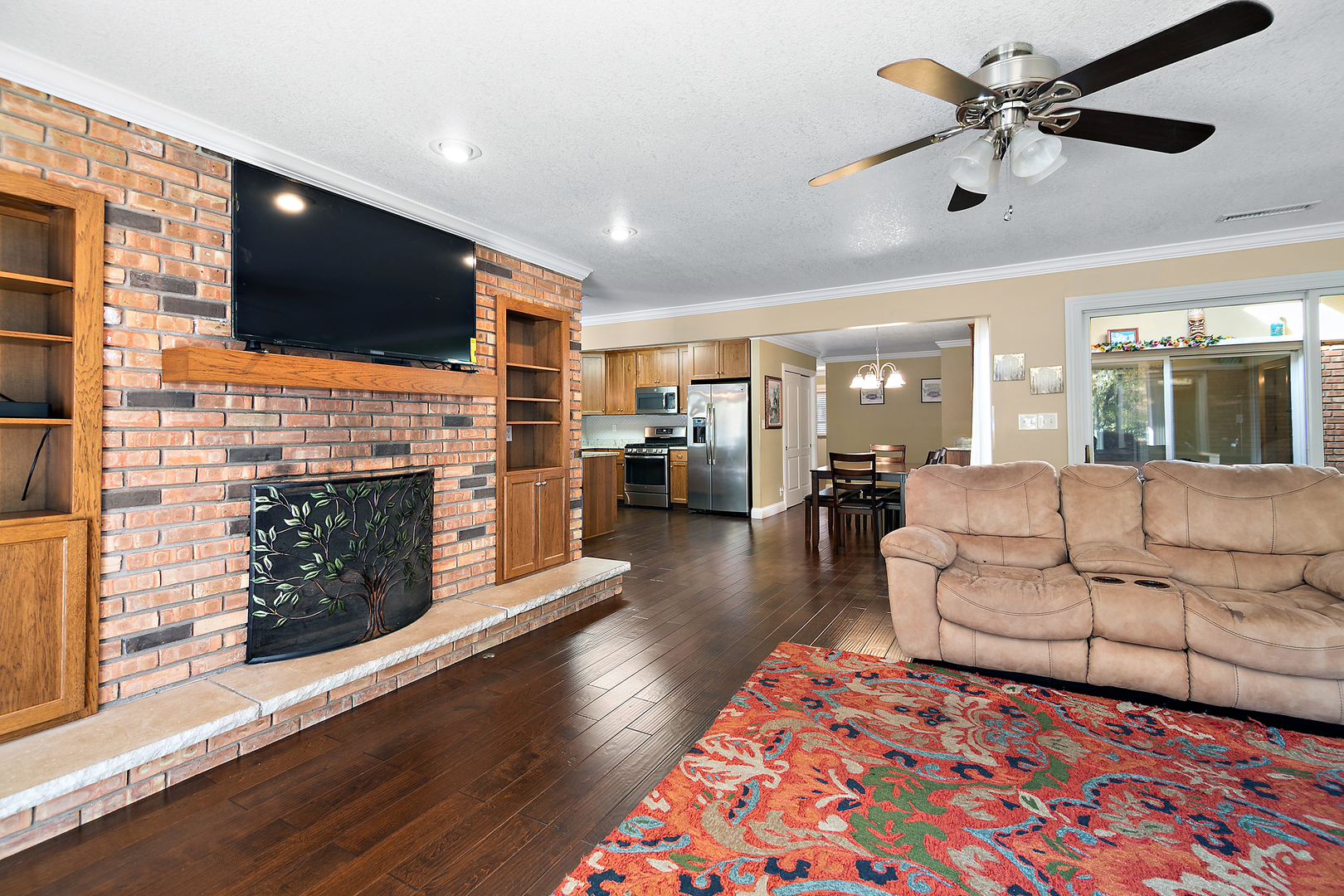 1305 Oaktree Lane Kankakee, IL 60901 - Photo 22 of 47 a living room with fireplace furniture and a flat screen tv