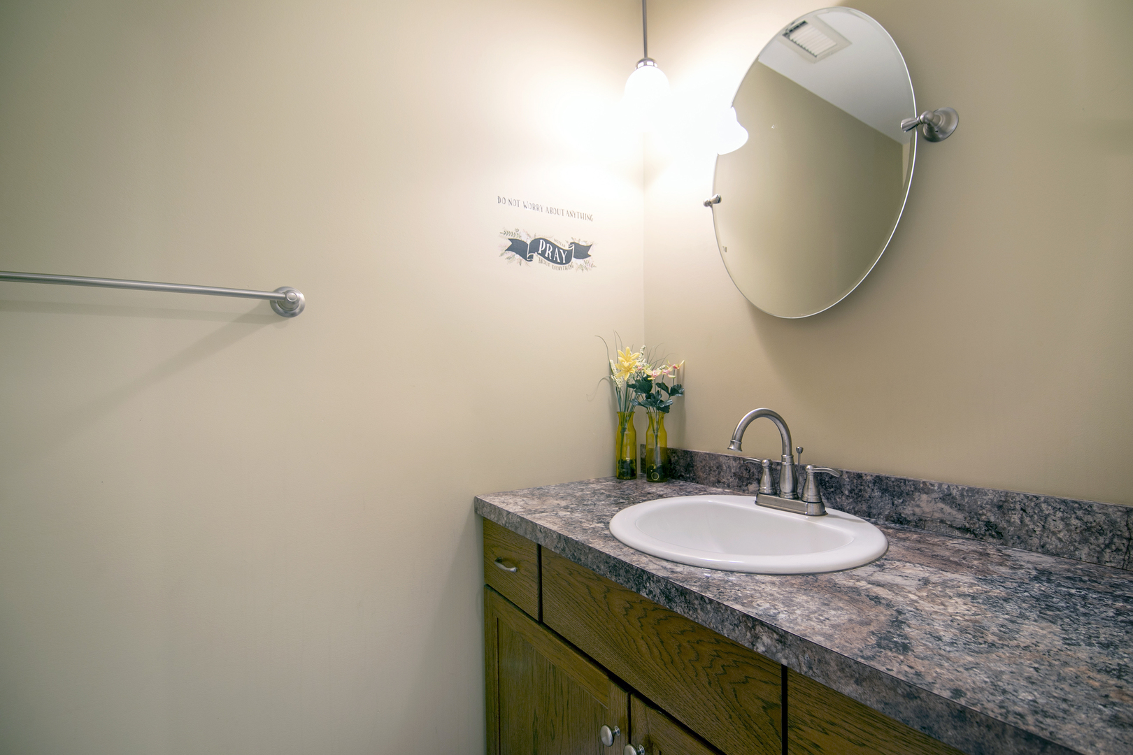 1305 Oaktree Lane Kankakee, IL 60901 - Photo 27 of 47 a bathroom with a sink and a mirror