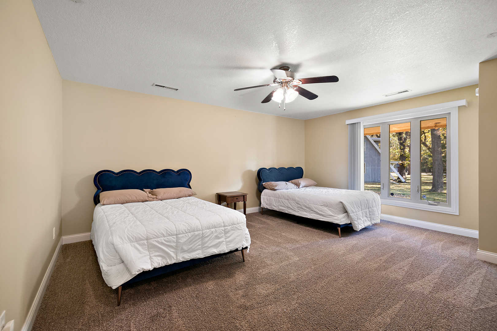 1305 Oaktree Lane Kankakee, IL 60901 - Photo 28 of 47 a bedroom with a bed and a chandelier