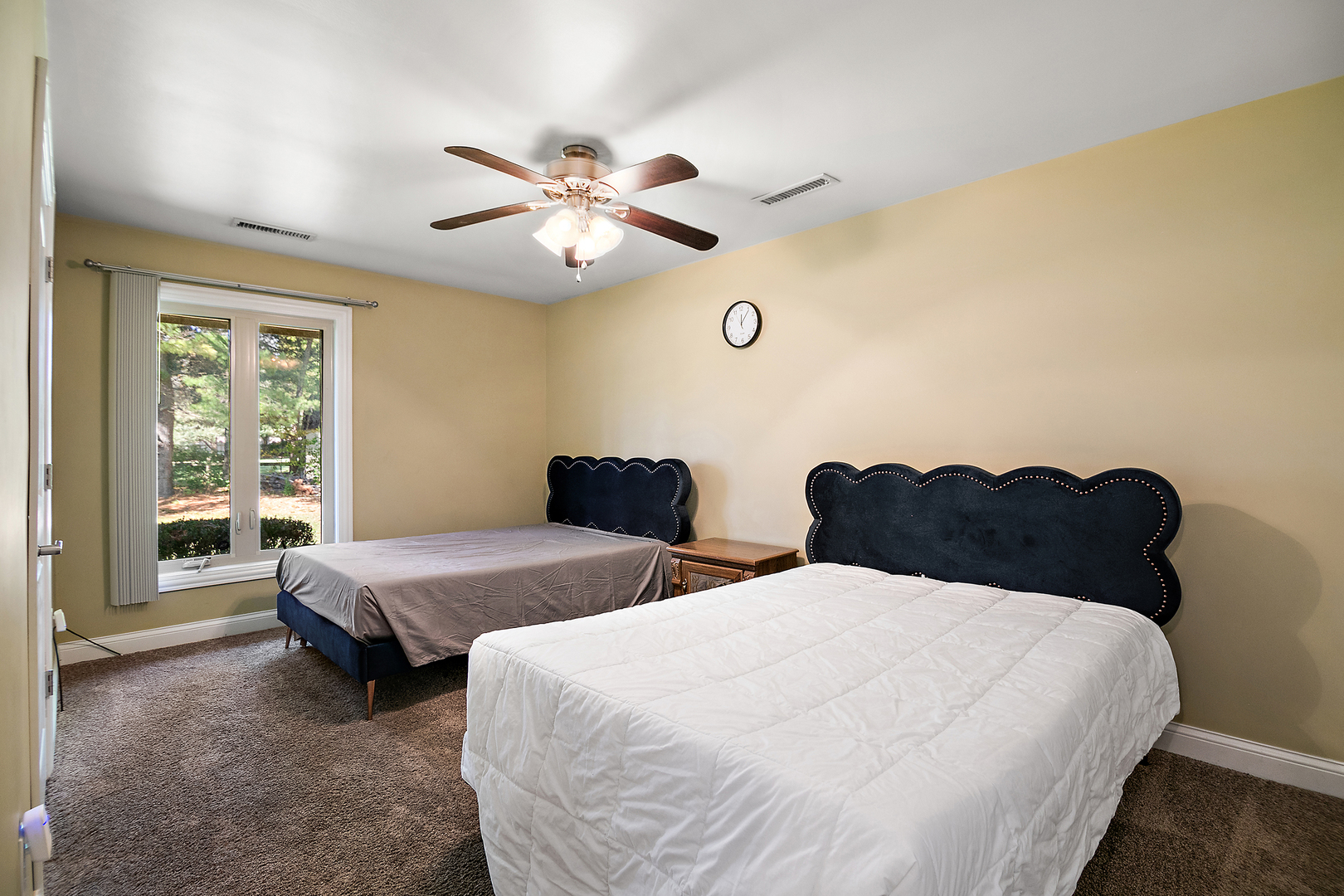 1305 Oaktree Lane Kankakee, IL 60901 - Photo 30 of 47 a spacious bedroom with two beds and a chandelier