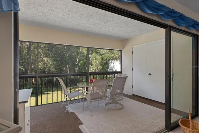 a kitchen with stainless steel appliances granite countertop a sink and a refrigerator