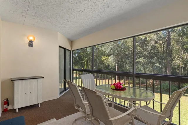 a kitchen with stainless steel appliances granite countertop a sink a stove and refrigerator