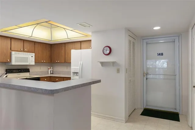 a kitchen with a sink a counter top space and appliances