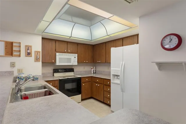 a bedroom with two beds and a chandelier