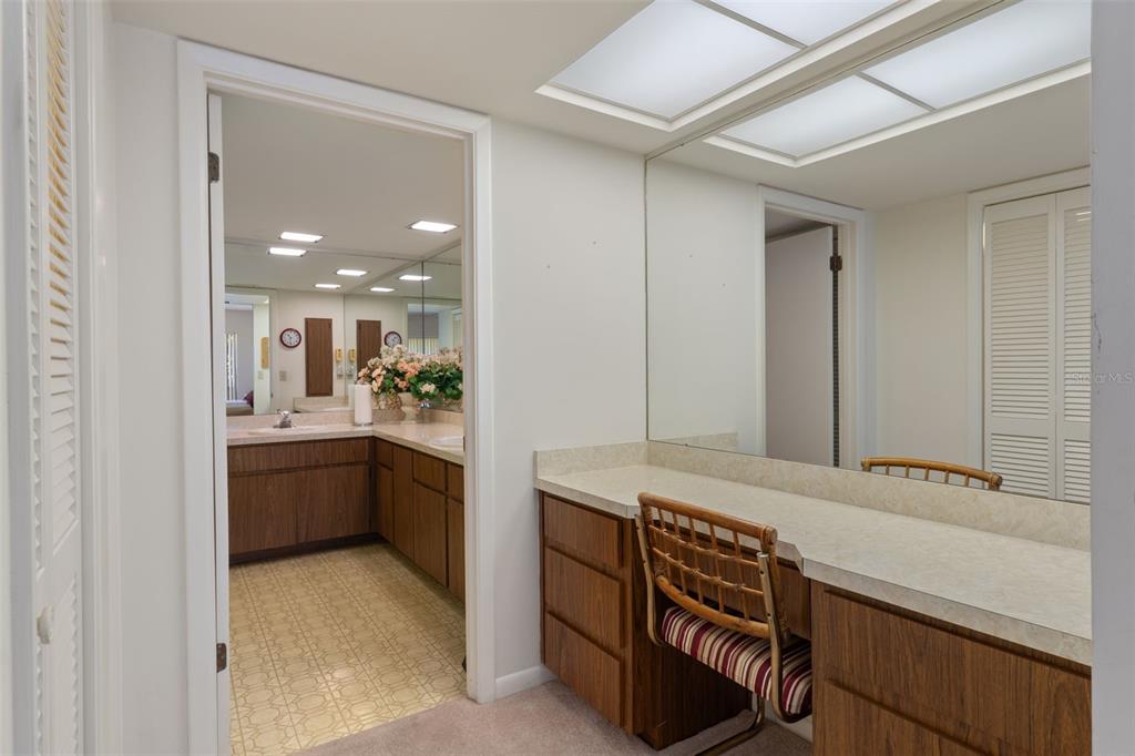 1 Cypress Run, Unit 14B Homosassa, FL 34446 - Photo 27 of 73 a spacious bathroom with a double vanity sink a mirror and a bathtub