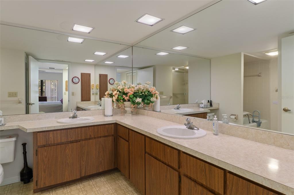 1 Cypress Run, Unit 14B Homosassa, FL 34446 - Photo 28 of 73 a bathroom with a double vanity sink and a mirror