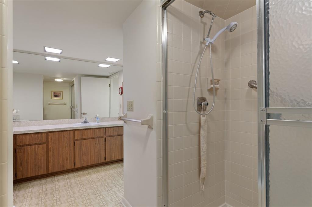 1 Cypress Run, Unit 14B Homosassa, FL 34446 - Photo 30 of 73 a bathroom with a double vanity sink and mirror