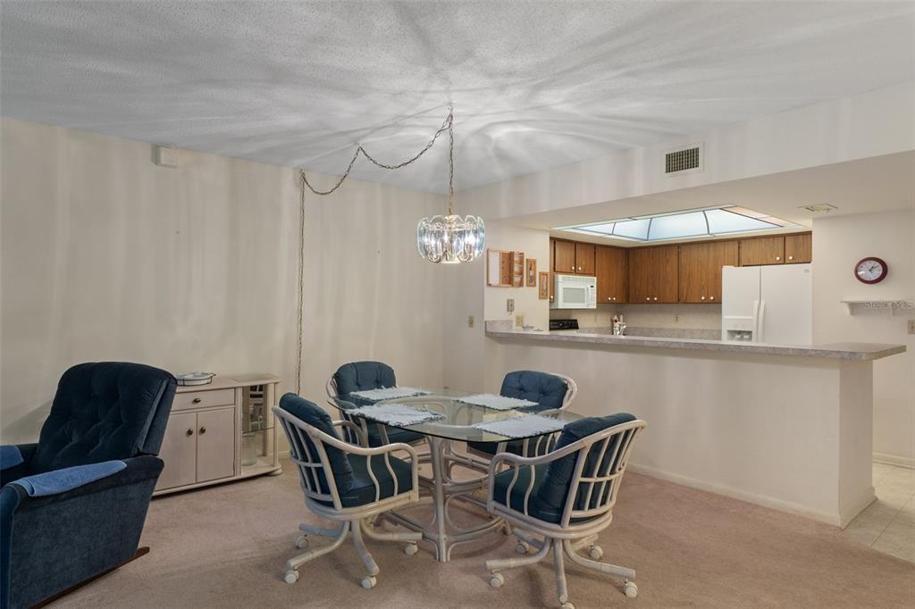 1 Cypress Run, Unit 14B Homosassa, FL 34446 - Photo 8 of 73 a view of a dining room with furniture and a chandelier