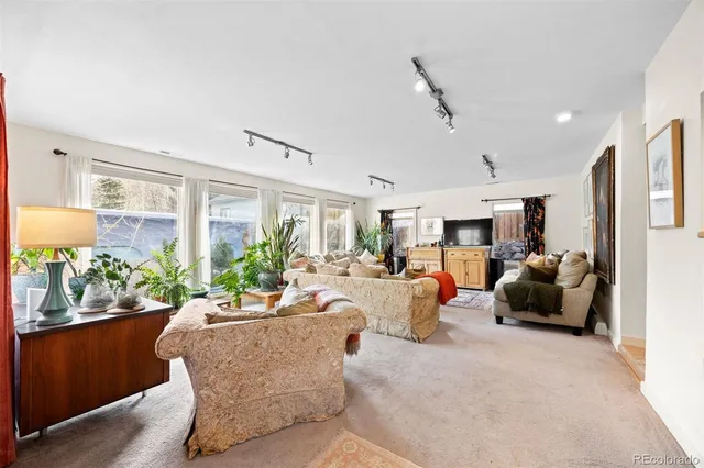 a kitchen with a refrigerator a stove top oven a sink and dishwasher