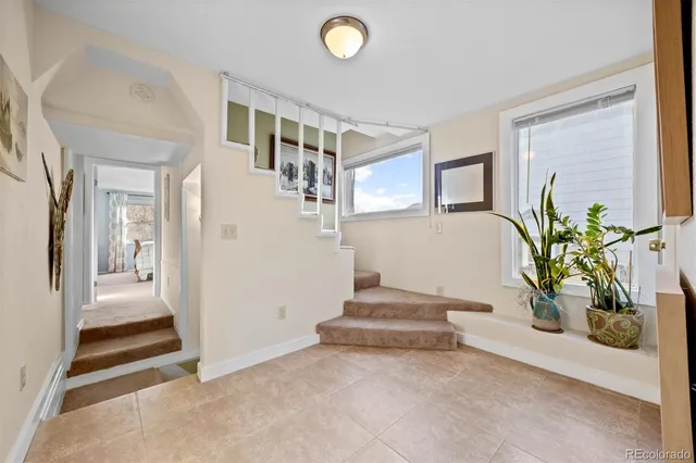 a bed room with a bed and a chair