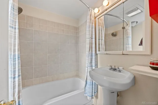 a bedroom with two beds and a couch