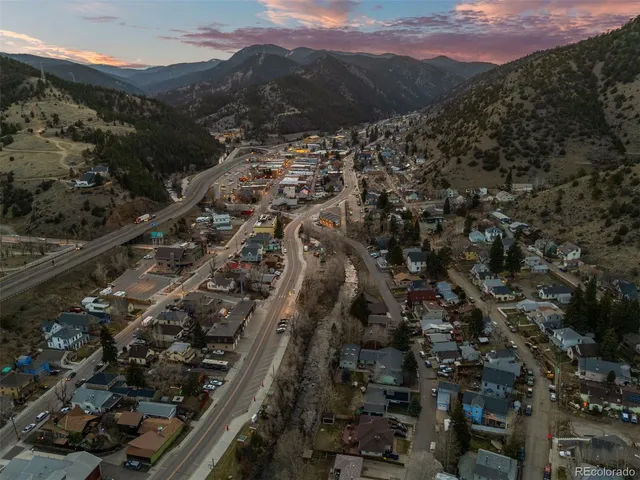 a view of a wooden house with a mountain