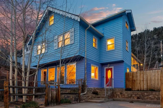 a view of a deck with couches chairs and wooden floor