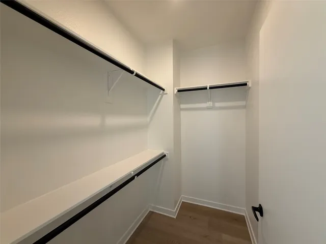 a bathroom with a sink toilet a mirror and shower