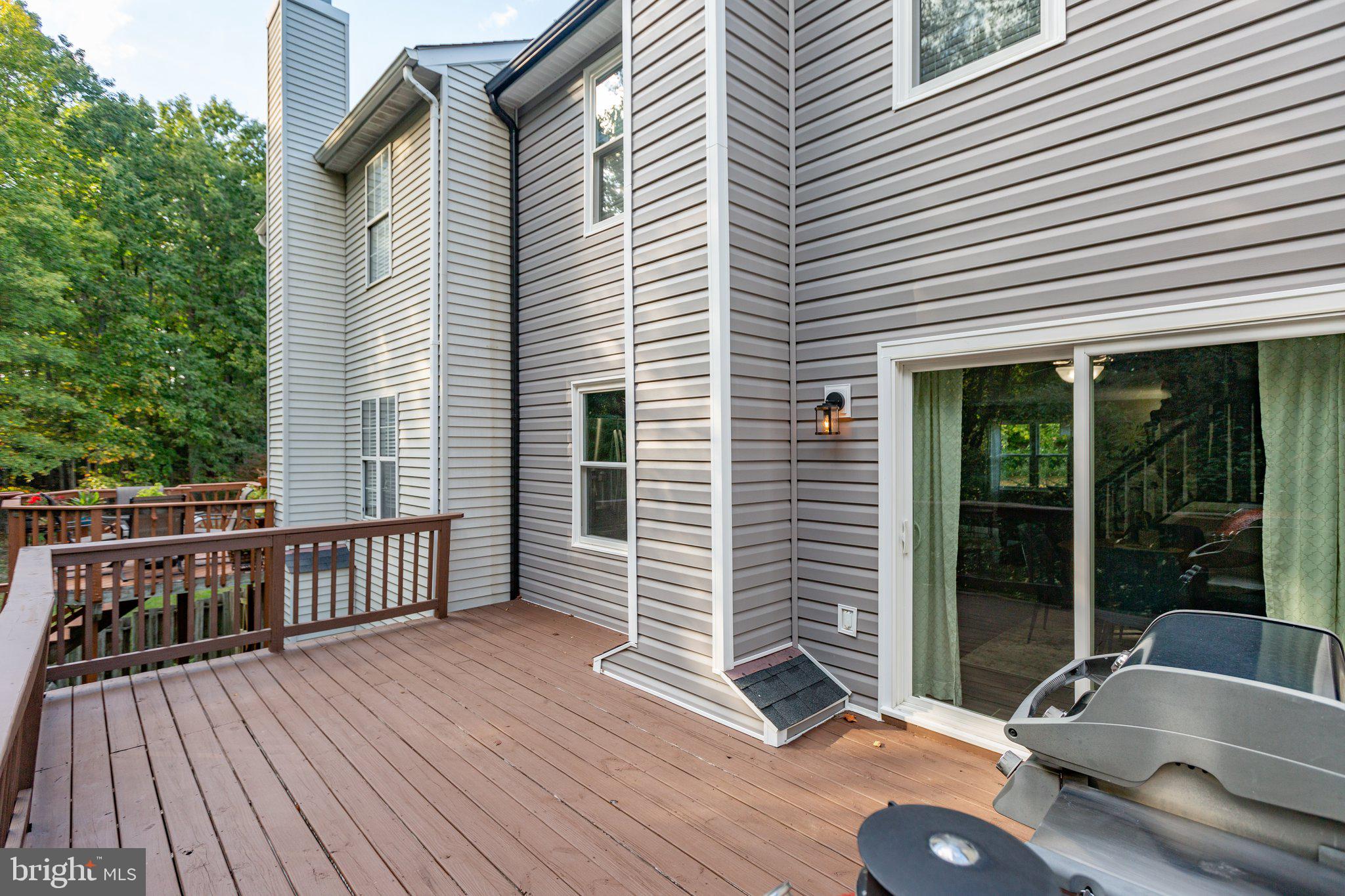 409 Crossing Road Fredericksburg, VA 22406 - Photo 35 of 43 The rear deck is oversized & epands across the rea