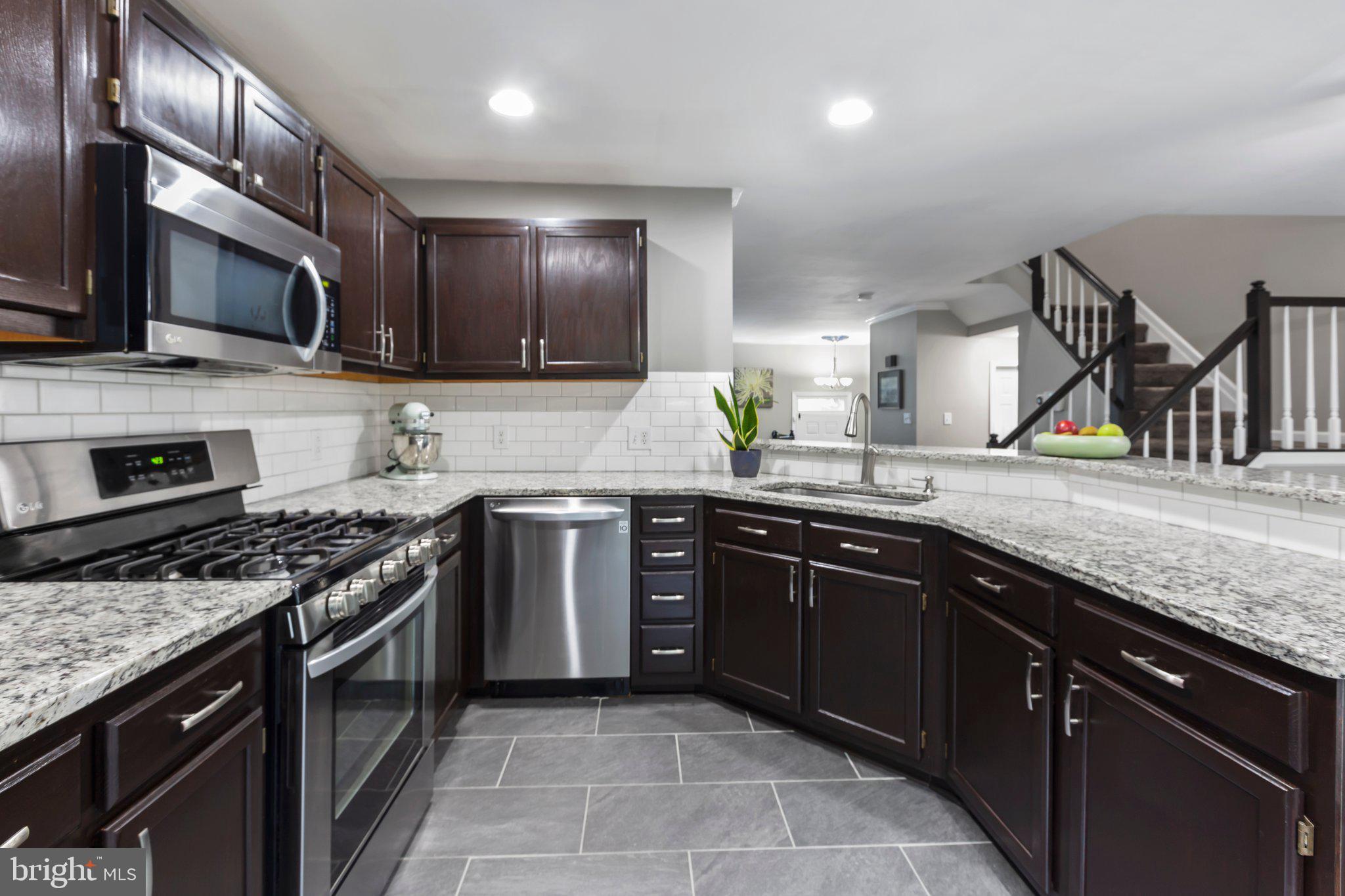 409 Crossing Road Fredericksburg, VA 22406 - Photo 9 of 43 Check the stainless appliances & granite counters