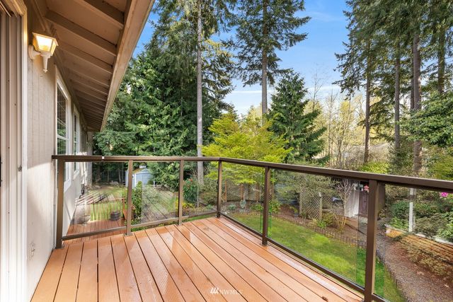 a view of a balcony with wooden floor