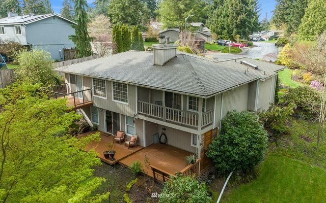 a view of a patio with table and chairs and potted plants