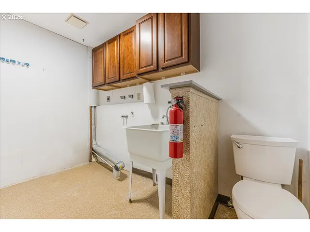 a bathroom with a toilet and sink