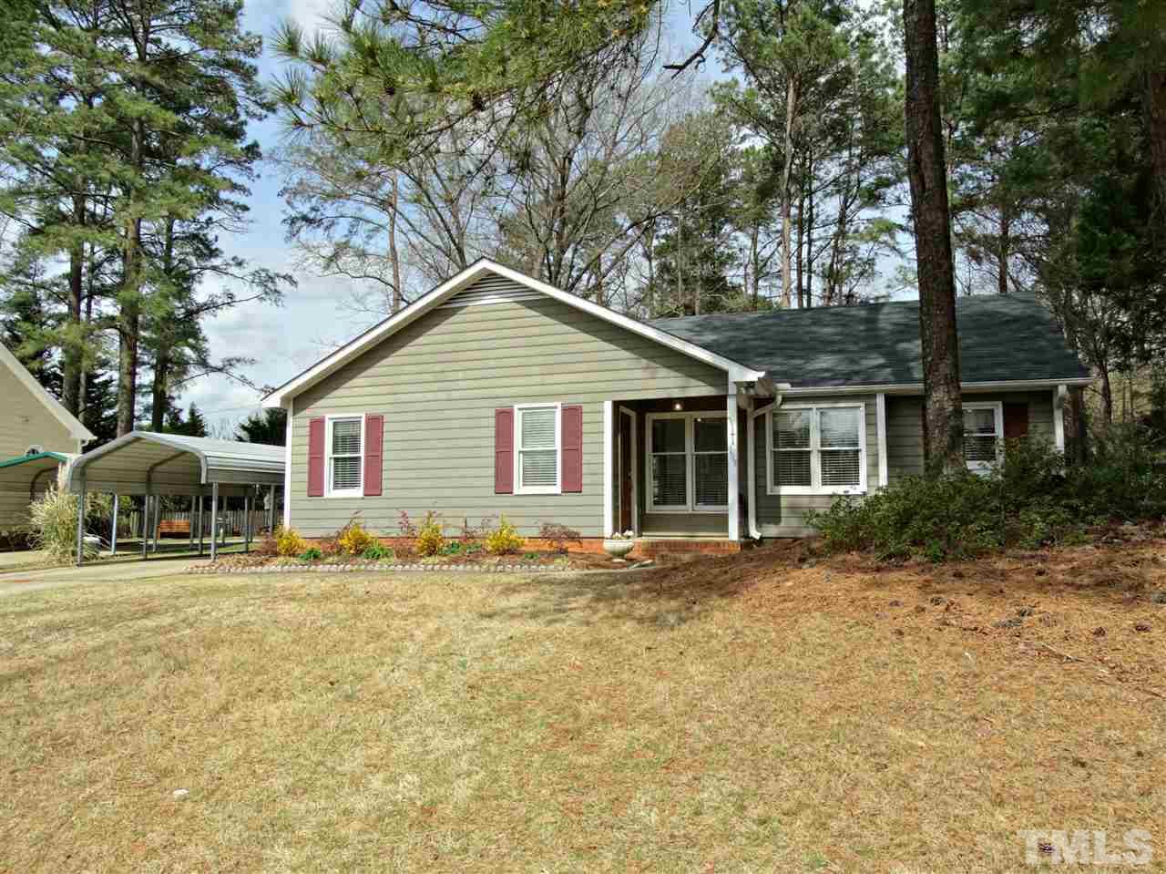 109 Longneedle Court Raleigh, NC 27603 - Photo 2 of 23 a front view of a house with a garden