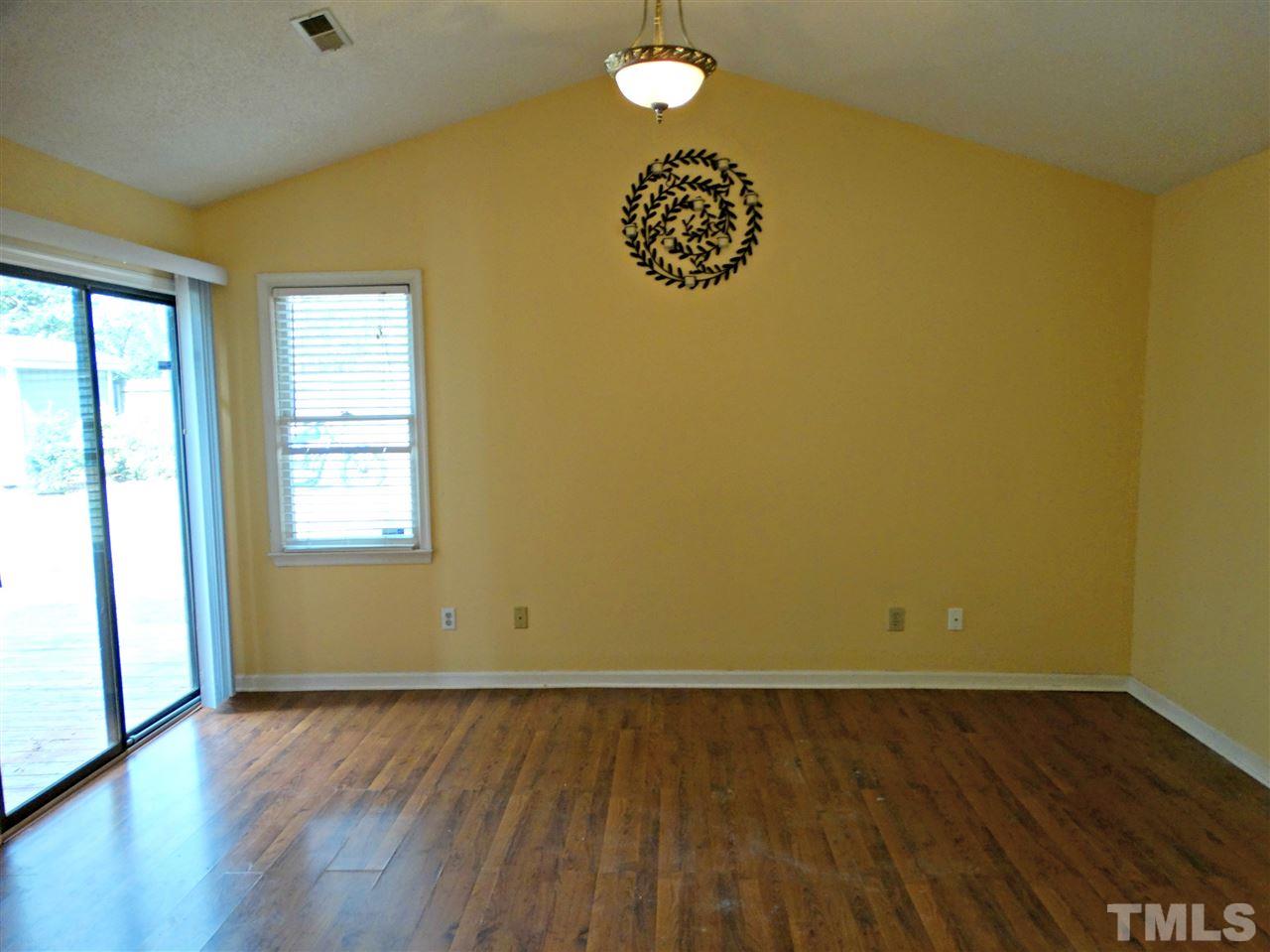 109 Longneedle Court Raleigh, NC 27603 - Photo 15 of 23 a view of a room with wooden floor and a window