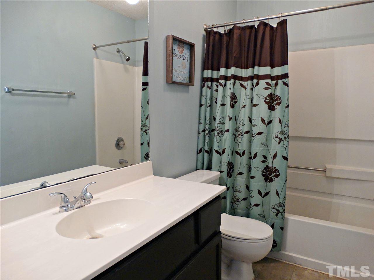 109 Longneedle Court Raleigh, NC 27603 - Photo 20 of 23 a bathroom with a sink toilet and shower