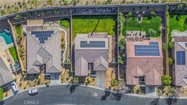 an aerial view of a house with a garden