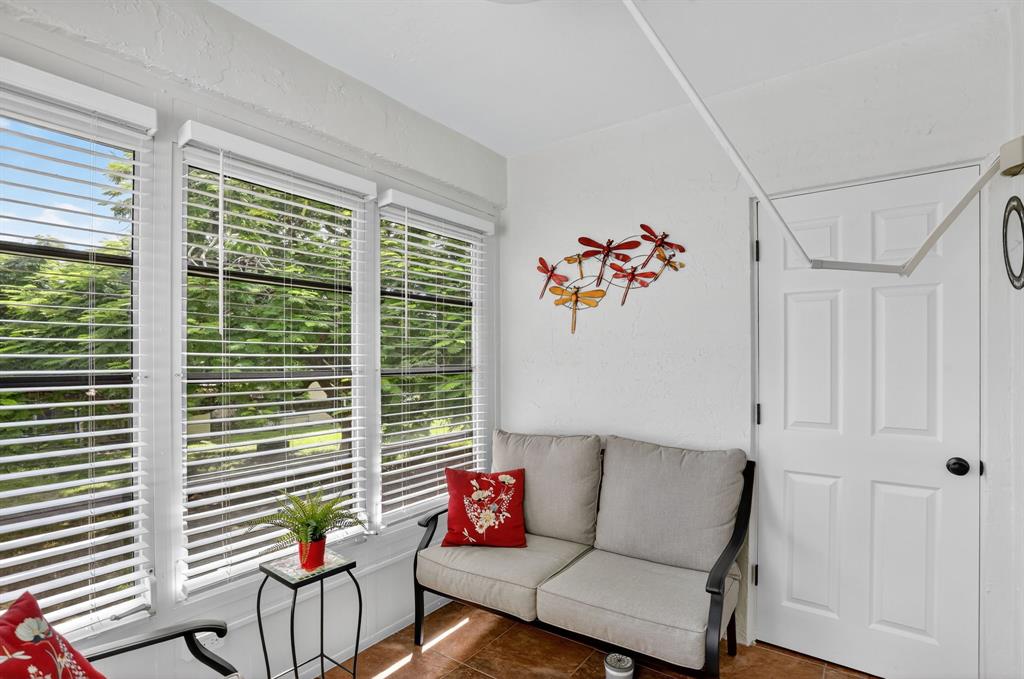 5640 Southwest 3rd Place, Unit 208 Margate, FL 33068 - Photo 14 of 26 a living room with furniture and a potted plant
