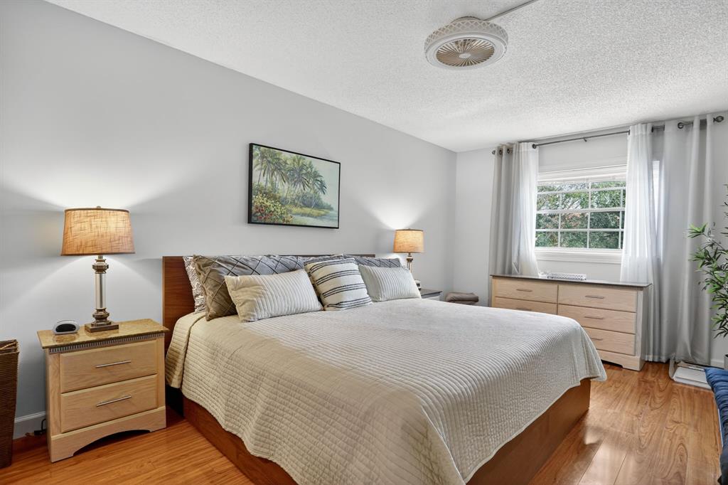 5640 Southwest 3rd Place, Unit 208 Margate, FL 33068 - Photo 15 of 26 a bedroom with a bed and a window