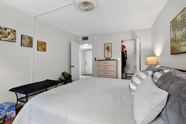 a bedroom with bed and window