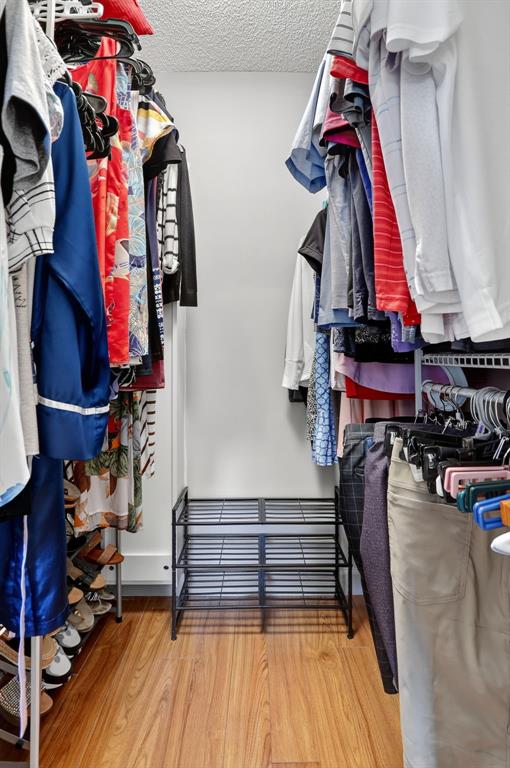 5640 Southwest 3rd Place, Unit 208 Margate, FL 33068 - Photo 17 of 26 a view of walk in closet with clothes and shoes