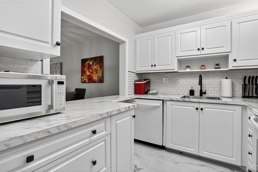 5640 Southwest 3rd Place, Unit 208 Margate, FL 33068 - Photo 6 of 26 a kitchen with cabinets appliances and a window