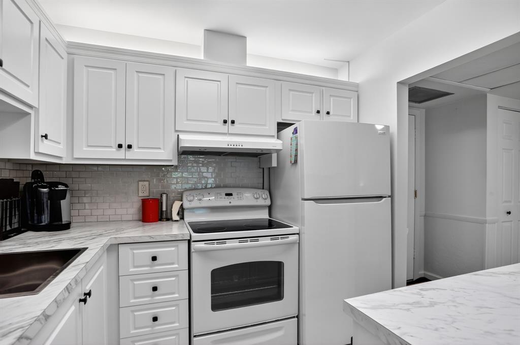 5640 Southwest 3rd Place, Unit 208 Margate, FL 33068 - Photo 7 of 26 a kitchen with cabinets and white appliances