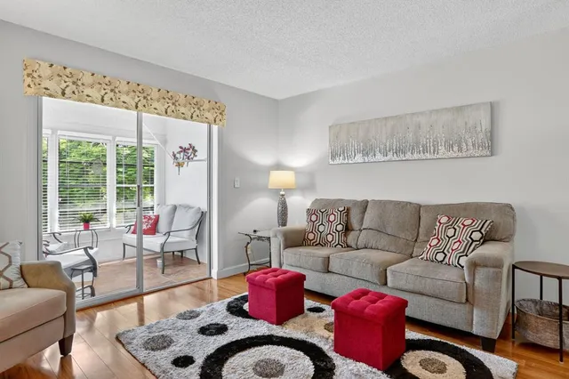 a living room with furniture or couch and a large window