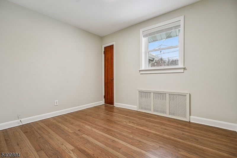 68 Valley Road Hillsborough, NJ 08844 - Photo 13 of 38 a view of an empty room with wooden floor and a window
