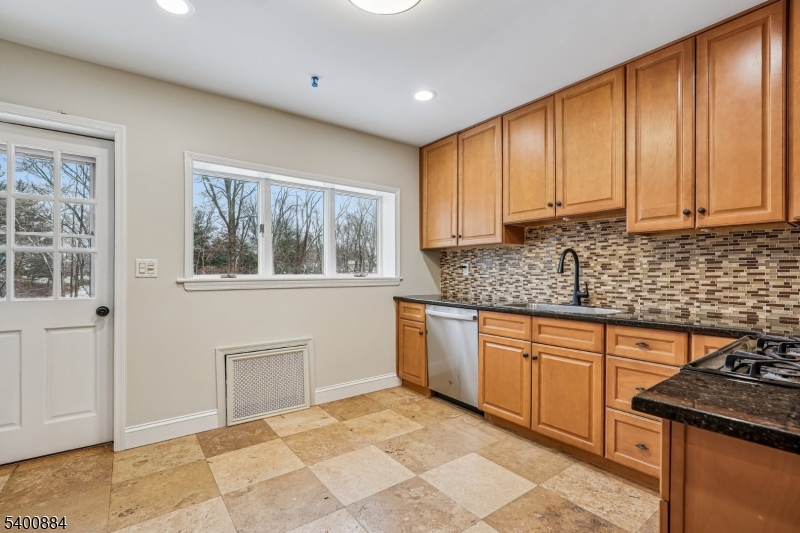 68 Valley Road Hillsborough, NJ 08844 - Photo 10 of 38 a kitchen with stainless steel appliances granite countertop a stove sink and cabinets