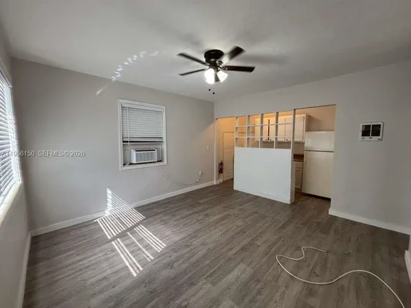 a view of livingroom with hardwood floor and ceiling fan